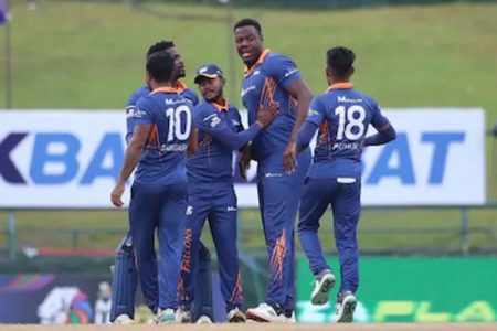 Teammates celebrate with Carlos Brathwaite (second from right) after he claimed one of his four wickets for Kandy Falcons against Jaffna Kings in the Lanka Premier League T20 on Wednesday at the Pallekele International Cricket Stadium. (SLC photo)