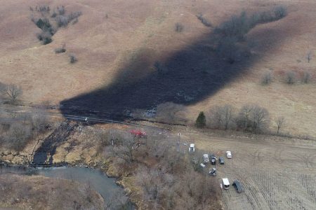 Emergency crews work to clean up the largest U.S. crude oil spill in nearly a decade, following the leak at the pipeline operated by TC Energy in rural Washington County, Kansas, U.S., December 9, 2022. (Photo: REUTERS/Drone Base)
