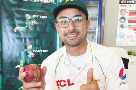 Pakistan’s Abrar Ahmed with the match ball after his seven wicket haul on debut.
