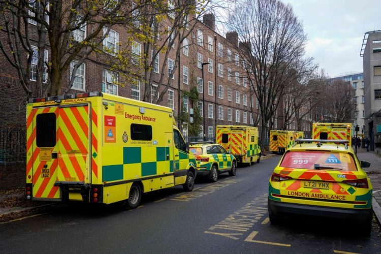 Ambulances are parked outside the Waterloo ambulance station in London on December 21, 2022. (Photo by Niklas Halle'n / AFP)