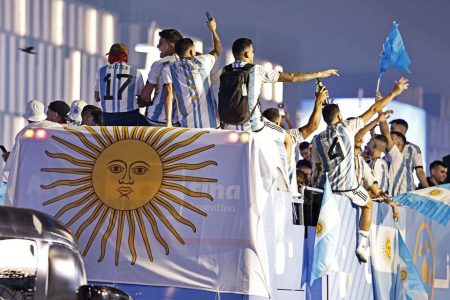 Argentina players celebrate on a bus outside the stadium after winning the World Cup REUTERS/Hamad I Mohammed
