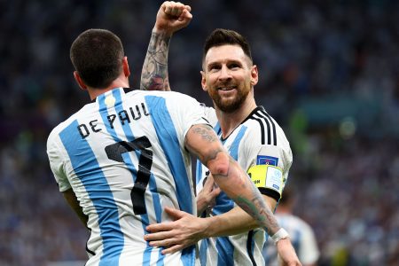 Soccer Football - FIFA World Cup Qatar 2022 - Quarter Final - Netherlands v Argentina - Lusail Stadium, Lusail, Qatar - December 9, 2022 Argentina's Lionel Messi and Rodrigo De Paul celebrate after Nahuel Molina scores their first goal REUTERS/Kai Pfaffenbach