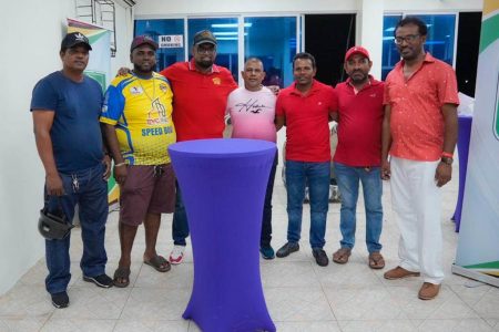 President Irfaan Ali (third from left) with boat operators and others yesterday. (Office of the President photo)