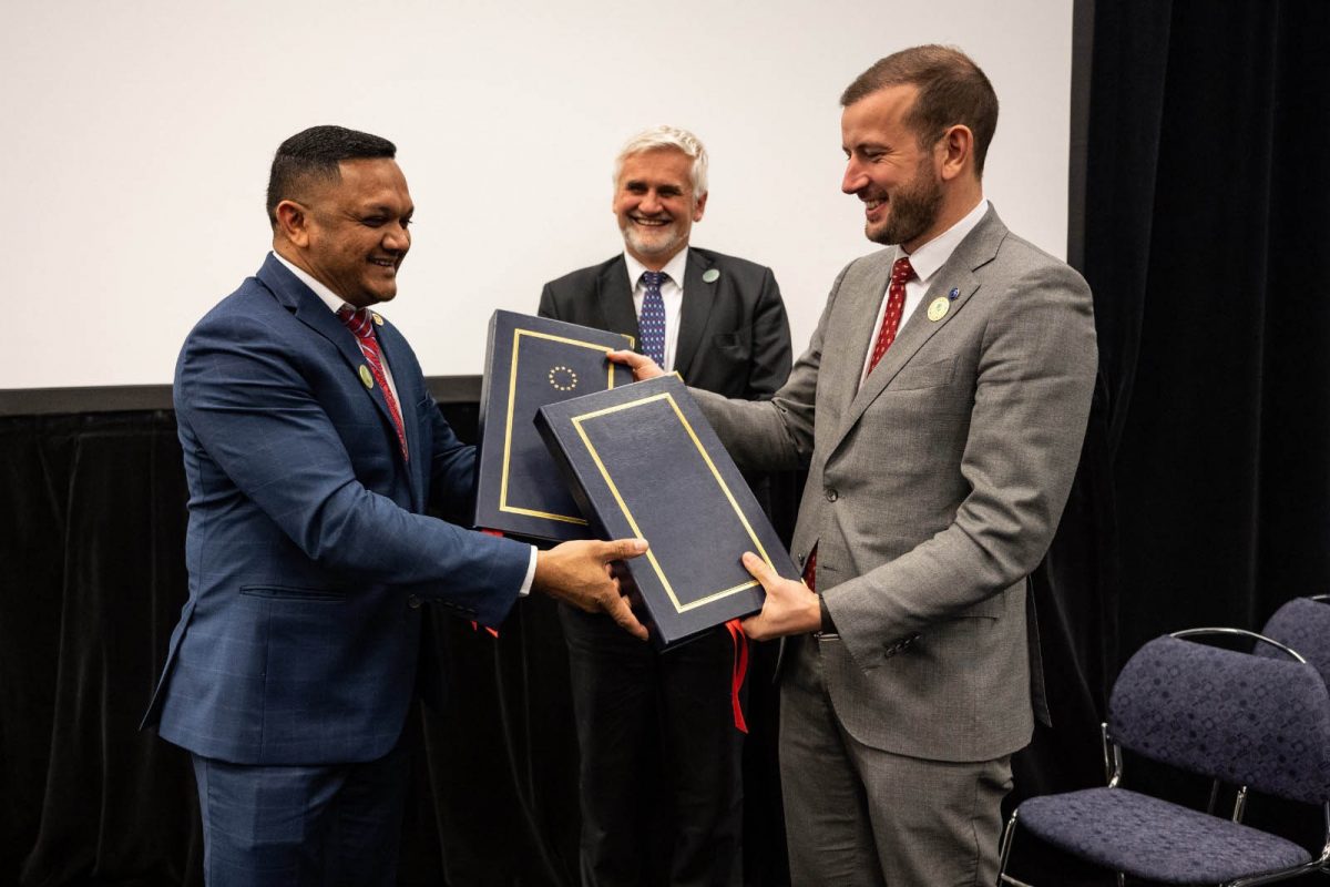Minister of Natural Resources Vickram Bharrat (left) and European Commissioner for Environment, Oceans and Fisheries Virginijus Sinkevičius exchanging the agreement. At centre is Jan Dusík, Deputy Minister of the Environment of the Czech Republic. 