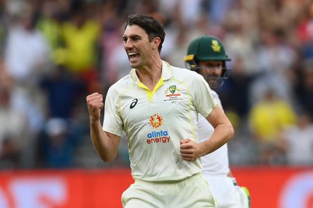 Pat Cummins is elated after taking a wicket.