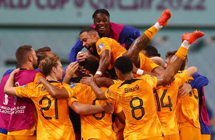 Netherlands’ Daley Blind celebrates scoring their second goal with Memphis Depay and teammates REUTERS/Matthew Childs