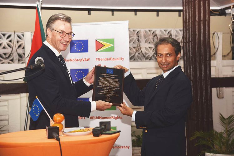 European Union Ambassador René van Nes (left) presenting the award to Stabroek News Editor-in-Chief Anand Persaud (Delegation of the EU in Guyana photo) 