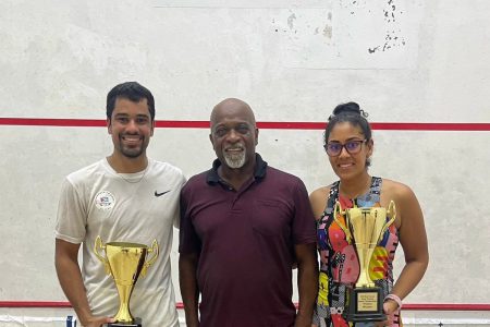 Sibling dominance! Newly crowned men and women’s national champions Jason Ray Khalil and Ashley Khalil pose with their spoils in the presence of national coach Carl Ince 