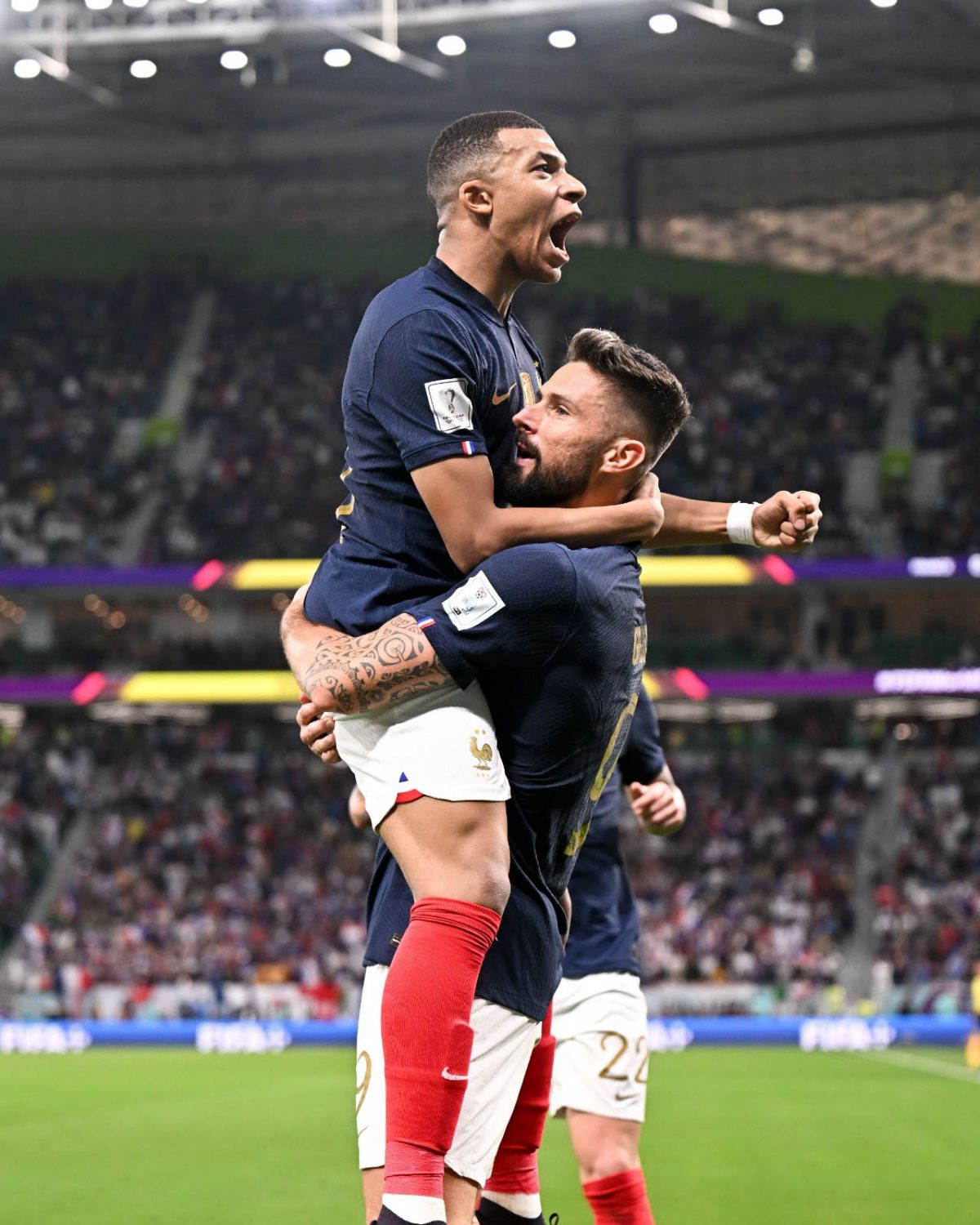 YOU LIFTED US UP! France’s Theo Hernandez lifts up teammate Kylian Mbappe after the star forward had netted against Poland yesterday. (Photo courtesy Twitter)
