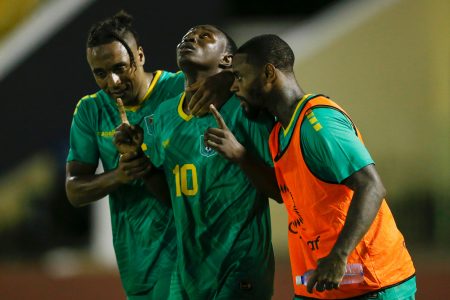 Omari Glasgow (centre) was the star in Guyana’s opening CNL encounter. 