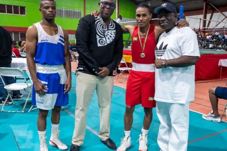 FLASHBACK! Guyana Boxing Association (GBA) President Steve Ninvalle (2nd from left), and Assistant Secretary/Treasurer Seon Bristol (right) posing alongside Featherweight champion Keevin Allicock (3rd from left) and divisional runner-up Samuel Greene of Suriname following the end of their bout at the recent Terrence Ali Open boxing championships at the National Gymnasium.
