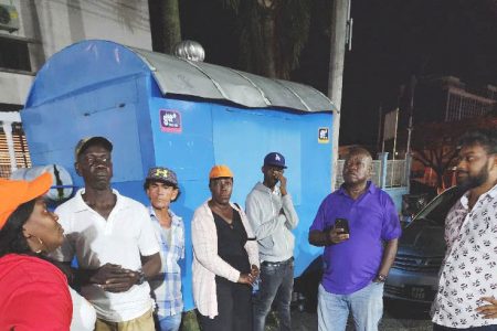 Mayor Ubraj Narine (right) and Opposition Leader Aubrey Norton (second from right) engaging the vendors on Monday evening
