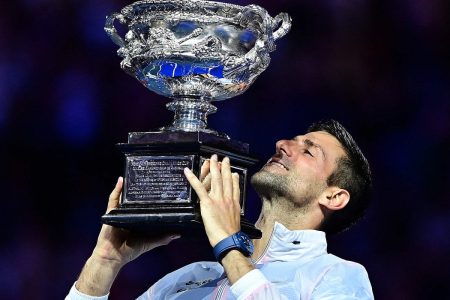 Novak Djokovic celebrates with the Australian Open trophy following his victory against Stefanos Tsitsipas. Photograph: Manan Vatsyayana/AFP/Getty Images
