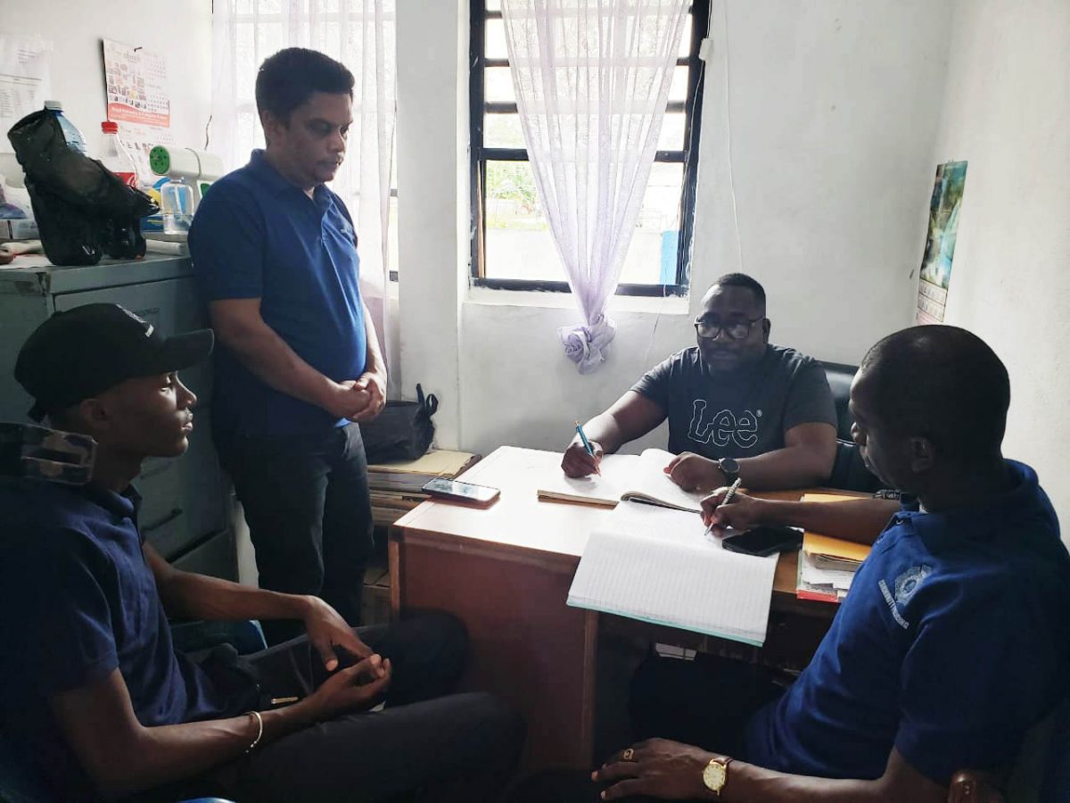 West La Penitence CPG representatives meeting with Sergeant Hinds (seated)