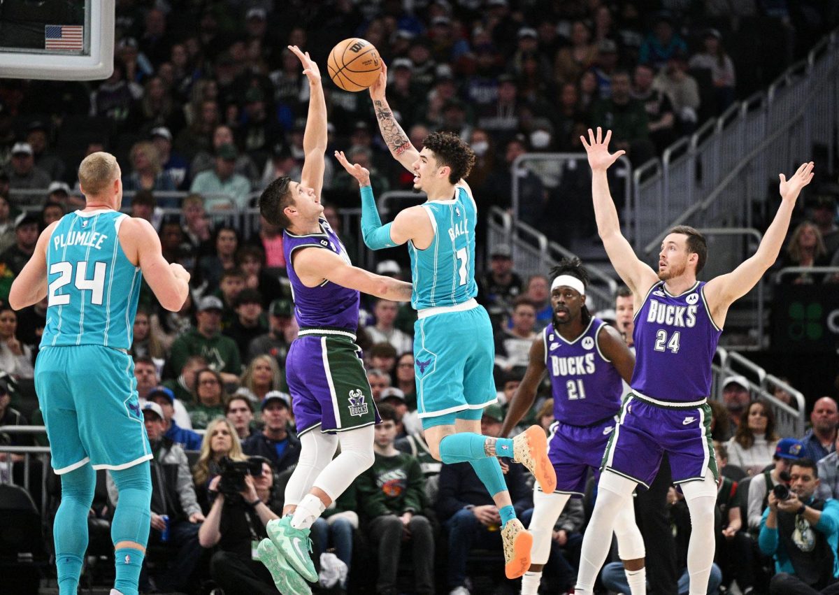 Charlotte Hornets guard LaMelo Ball (1) looks for someone to pass to against Milwaukee Bucks guard
Grayson Allen (12) in the first half at Fiserv Forum. Mandatory Credit: Michael McLoone-USA TODAY Sports