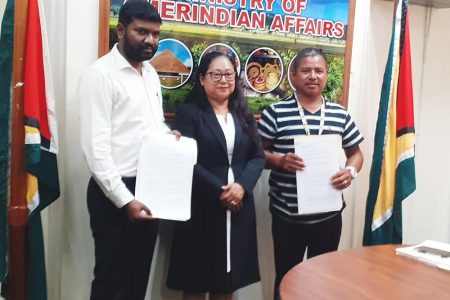 From left - Director of EKAA HRIM Earth Resource Management Inc, Jesvin Pradeep Kumar; Minister of Amerindian Affairs Pauline Sukhai; and Batavia Toshao Oren Williams