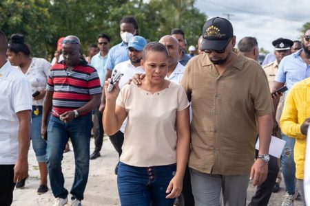 President Mohamed Irfaan Ali (right) engaged residents during his walk-through exercise at Yarrowkabra yesterday afternoon. (Department of Public Information photo)