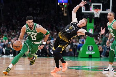 Boston Celtics forward Jayson Tatum (0) drives the ball against Golden State Warriors guard Donte DiVincenzo (0) in the second half at TD Garden. Mandatory Credit: David Butler II-USA TODAY Sports