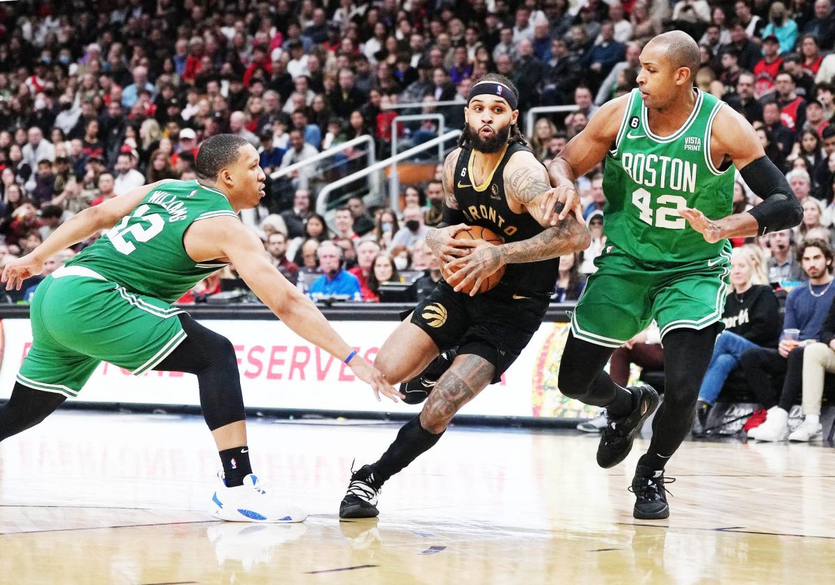 Toronto Raptors guard Gary Trent Jr. (33) drives to the basket as Boston Celtics center Al Horford (42) and forward Grant Williams (12) defend during the fourth quarter at Scotiabank Arena. Mandatory Credit: Nick Turchiaro-USA TODAY Sports
