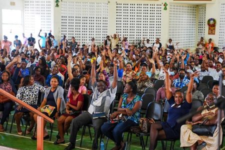 Parents of displaced Christ Church Secondary students at the meeting in the Queen’s College auditorium