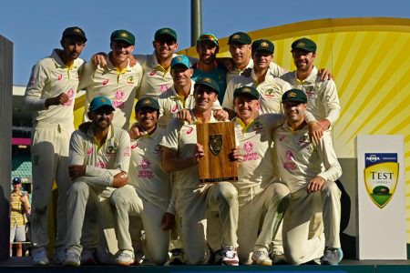 [1/6] Australia’s Pat Cummins celebrates winning the series with the trophy and teammates REUTERS/Jaimi Joy.