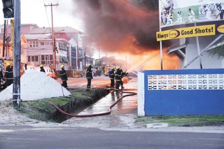 Firemen battling the blaze (Ministry of Home Affairs photo)