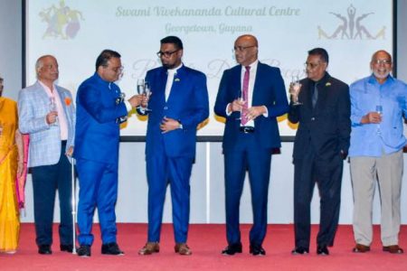 President Irfaan Ali (fifth from left) and Indian High Commissioner to Guyana Dr K J Srinivasa sharing a toast at the observance of India’s Republic Day anniversary. (Indian High Commission photo)