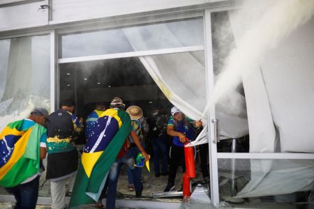 Supporters of Brazil's former President Jair Bolsonaro break into a building during a demonstration against President Luiz Inacio Lula da Silva in Brasilia, Brazil, December 8, 2023. REUTERS/Adriano Machado