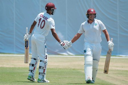Joshua Da Silva, right, struck a hundred on yesterday’s second day of the four-day tour-match while Roston Chase, left made 87. 