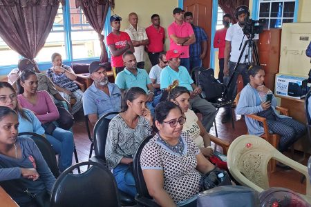 Leguan residents listening to Minister within the Ministry of Public Works, Deodat Indar (Ministry of Public Works photo)
