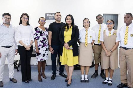 Vindhya Persaud (fifth from right), Vishok Persaud (sixth from right) with QC students, staff and members of QCOSA. (Vindhya Persaud’s Facebook page)
