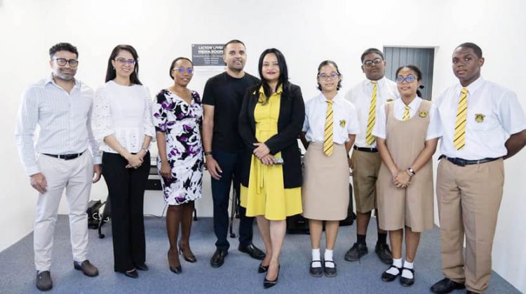 Vindhya Persaud (fifth from right), Vishok Persaud (sixth from right) with QC students, staff and members of QCOSA. (Vindhya Persaud’s Facebook page)
