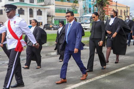Attorney General Anil Nandlall SC (second from left) taking part in the ceremonial parade yesterday along with judges and magistrates.  (Department of Public Information photo)