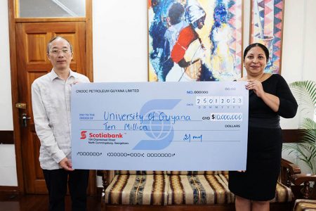 UG Vice-Chancellor, Professor Paloma Mohamed-Martin (right), receiving the $10 million contribution on behalf of the University from President of CPGL, Liu Xiaoxiang.
