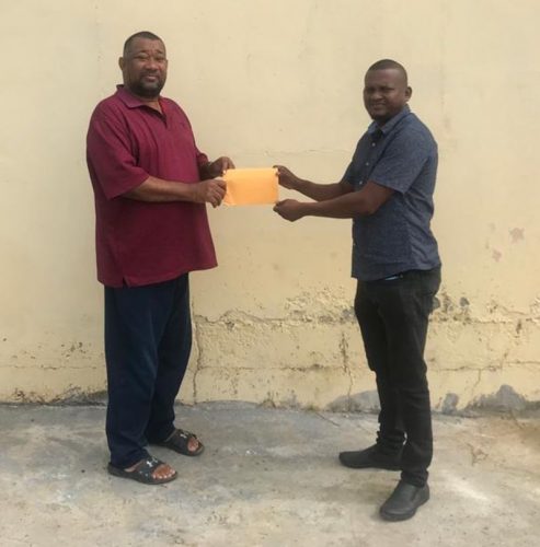 President of the Berbice Cricket Board, Hilbert Foster (left) collects the sponsorship cheque from RL Contracting CEO, Rondhall Lewis