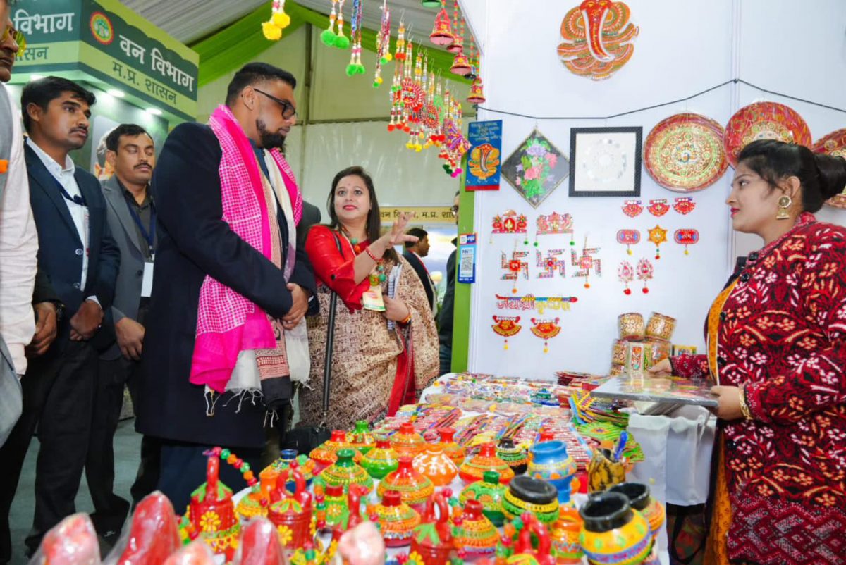 President Irfaan Ali (left) touring one of the booths (Office of the President photo)