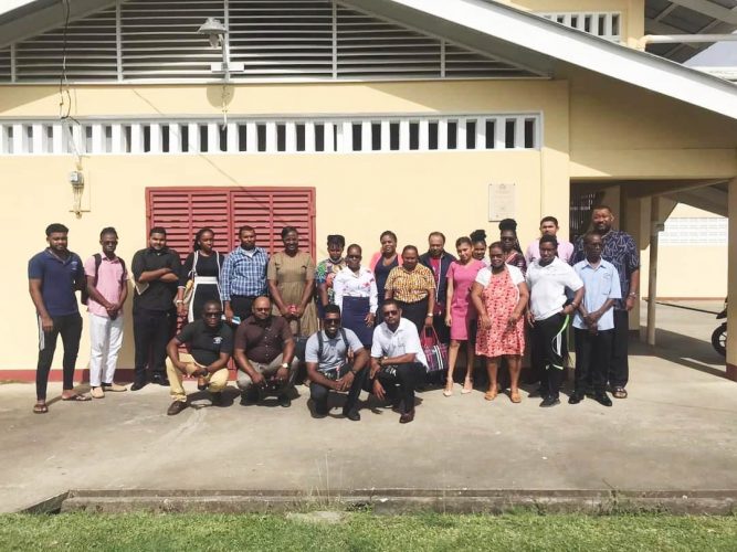 The BCB executives pose with the teachers after the meeting.