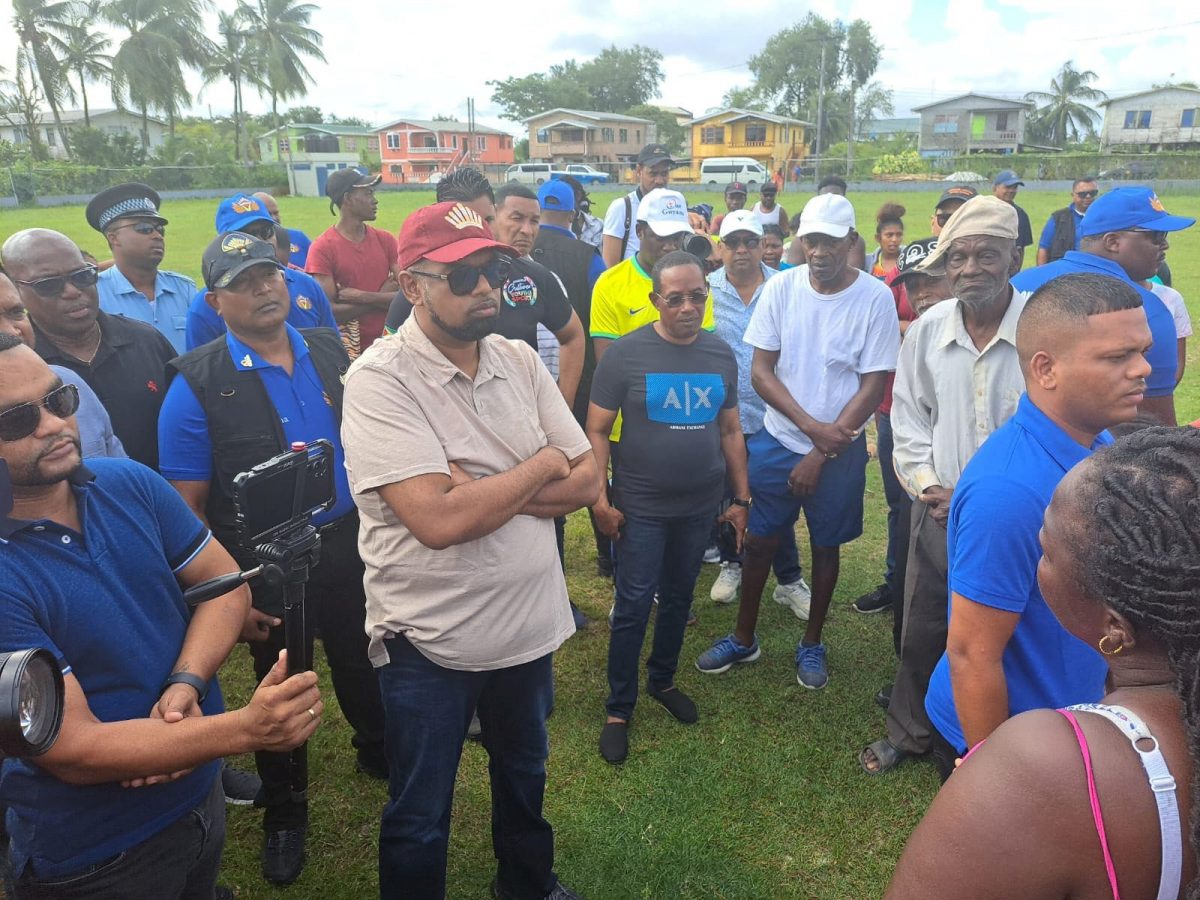 President Irfaan Ali (second from left) listening to the issues raised by residents of Agricola. (Office of the President photo) 