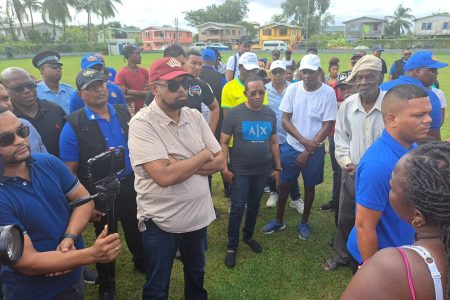 President Irfaan Ali (second from left) listening to the issues raised by residents of Agricola. (Office of the President photo) 