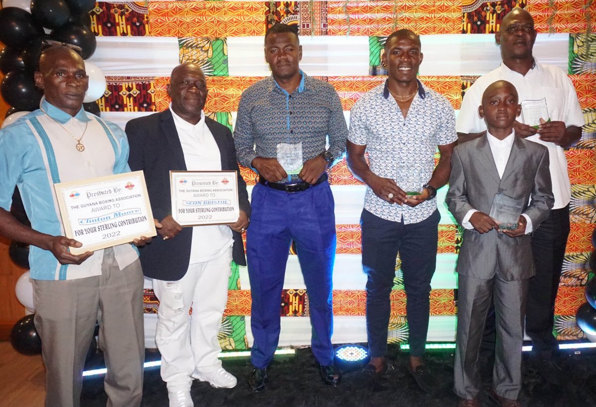 Desmond Amsterdam, (third from right) received the Best Boxer (Elite) accolade when the Guyana Boxing Association (GBA) hosted its award ceremony on Wednesday night at the Mirage Lounge. He is flanked by other awardees, from left Clinton Moore, Seon Bristol, Jermaine Craig, Ezekiel Bancroft and Terrence Poole M.S (Emmerson Campbell photo) 
