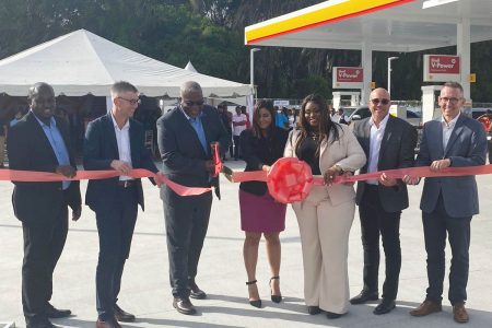 Prime Minister Mark Phillips (third from left), General Manager of Sol Guyana, Earl Carribon (left) and others at the ribbon-cutting ceremony.