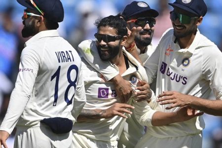 Ravindra Jadeja celebrating with teammates after claiming one of his eventual five wickets against Australia to skittle the visitors for 177 on day one of the opening test in Nagpur
