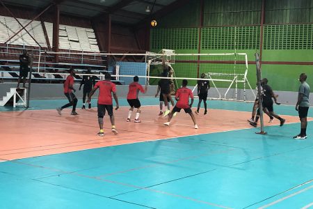 A scene from the Eagles (black) and Castrol Strikers clash in the DVA Senior Men’s Volleyball League at the National Gymnasium
