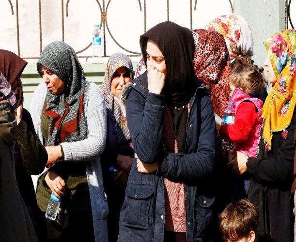 Women gather and grieve for the loss of family members, following the deadly earthquake in Reyhanli, Turkey, February 12, 2023. (Reuters photo)