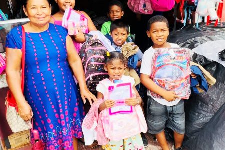 Amanda with her foster daughter and grandchildren after purchasing the school items with funds from Lucille

