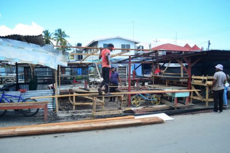 A stall that was burnt at Mon Repos being rebuilt.