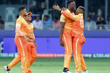 Carlos Brathwaite (third from left) celebrates with Gulf Giants teammates including Shimron Hetmyer (right) after taking a wicket against Desert Vipers in the final of the ILT20 on Sunday at the Dubai International Cricket Stadium in Dubai, United Arab Emirates. (ILT20 photo) 