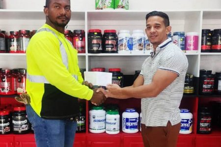  Yesterday, Jamie McDonald, CEO of Guyana’s leading gym equipment and fitness supplement supplier presented a sponsorship pact to aid Carlos Petterson-Grifith’s journey to The Ragnarok Games in Miami, Florida later this month.
