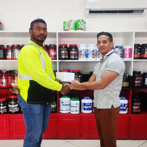  Yesterday, Jamie McDonald, CEO of Guyana’s leading gym equipment and fitness supplement supplier presented a sponsorship pact to aid Carlos Petterson-Grifith’s journey to The Ragnarok Games in Miami, Florida later this month.
