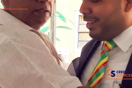A screen grab of Regional Executive Officer Donald Gajraj (left) attempting to secure the microphone from Chairman Daniel Seeram (right) 